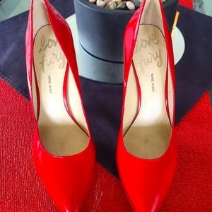Red patent leather pumps